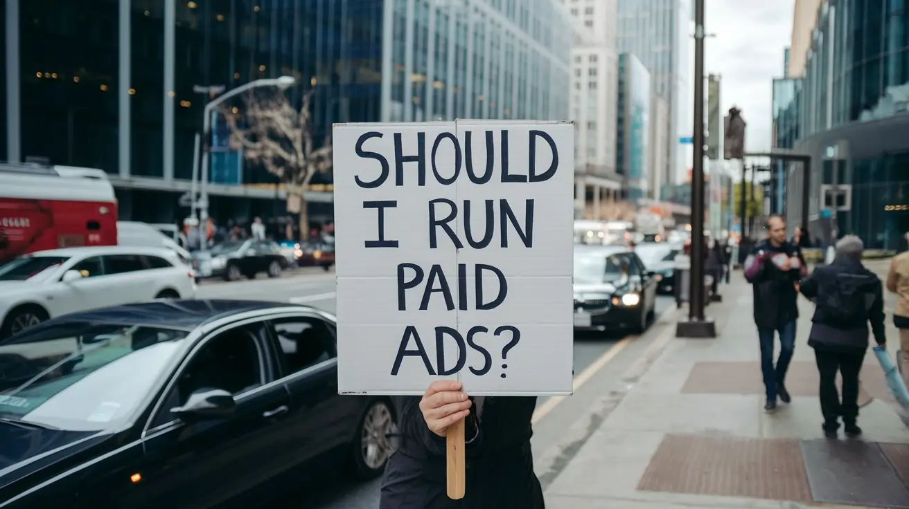 Person holding a sign asking "Should I run paid ads?" in a busy city street — Google Ads or Meta Ads decision
